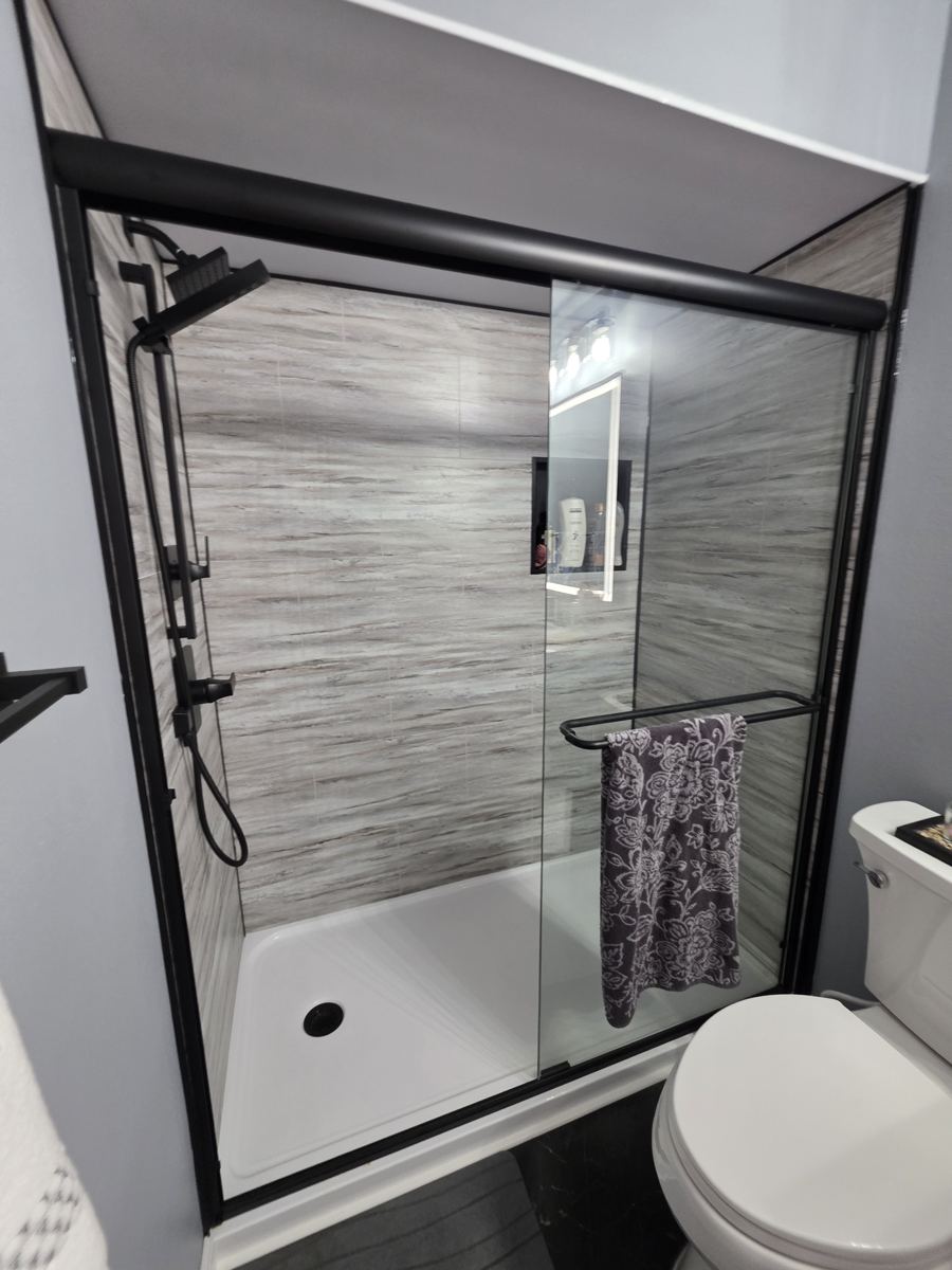 Remodeled bathroom with new glass shower and tile surround in Columbia County Oregon
