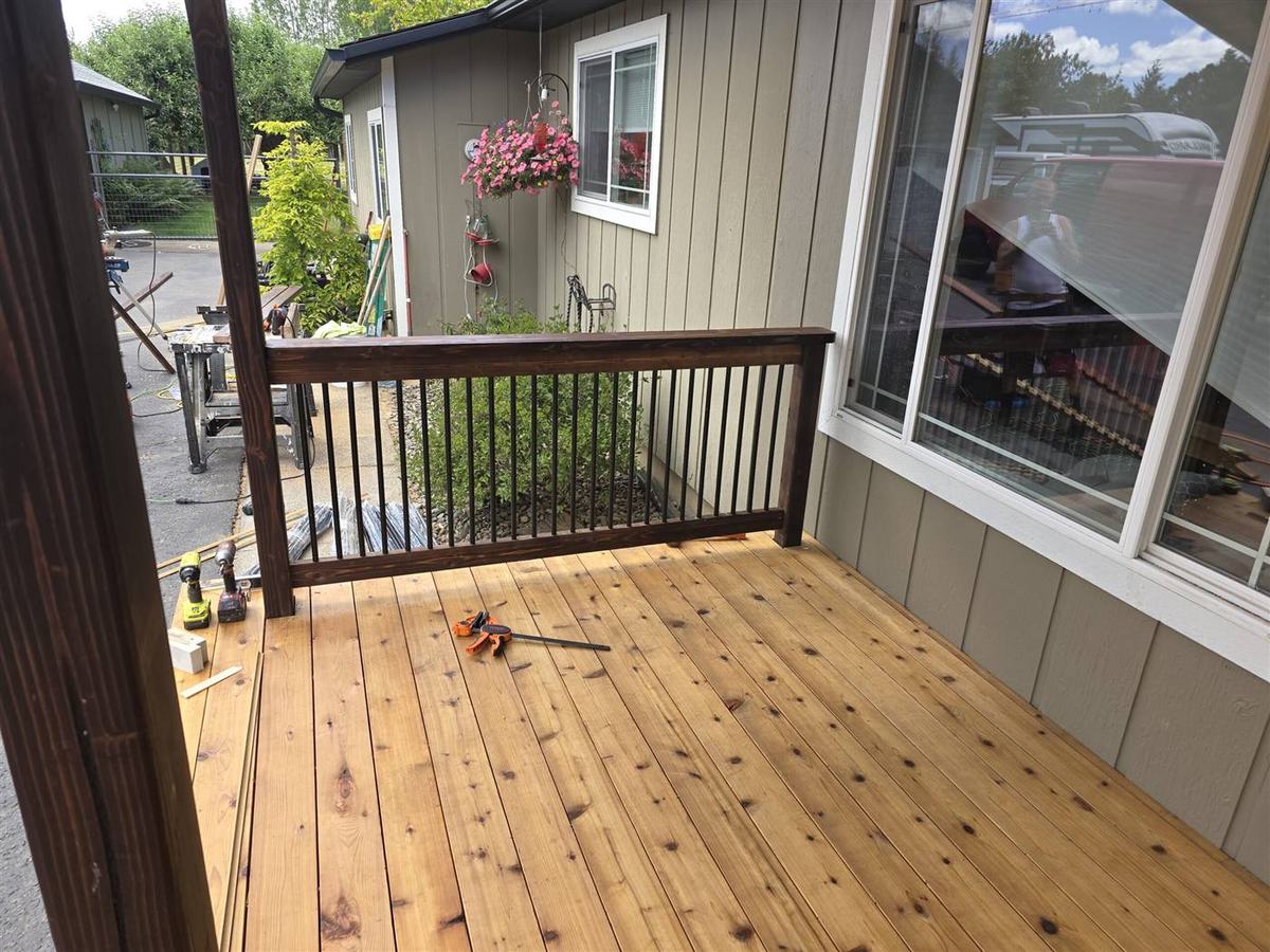 New cedar deck with stained railing built by deck builder in Columbia County Oregon