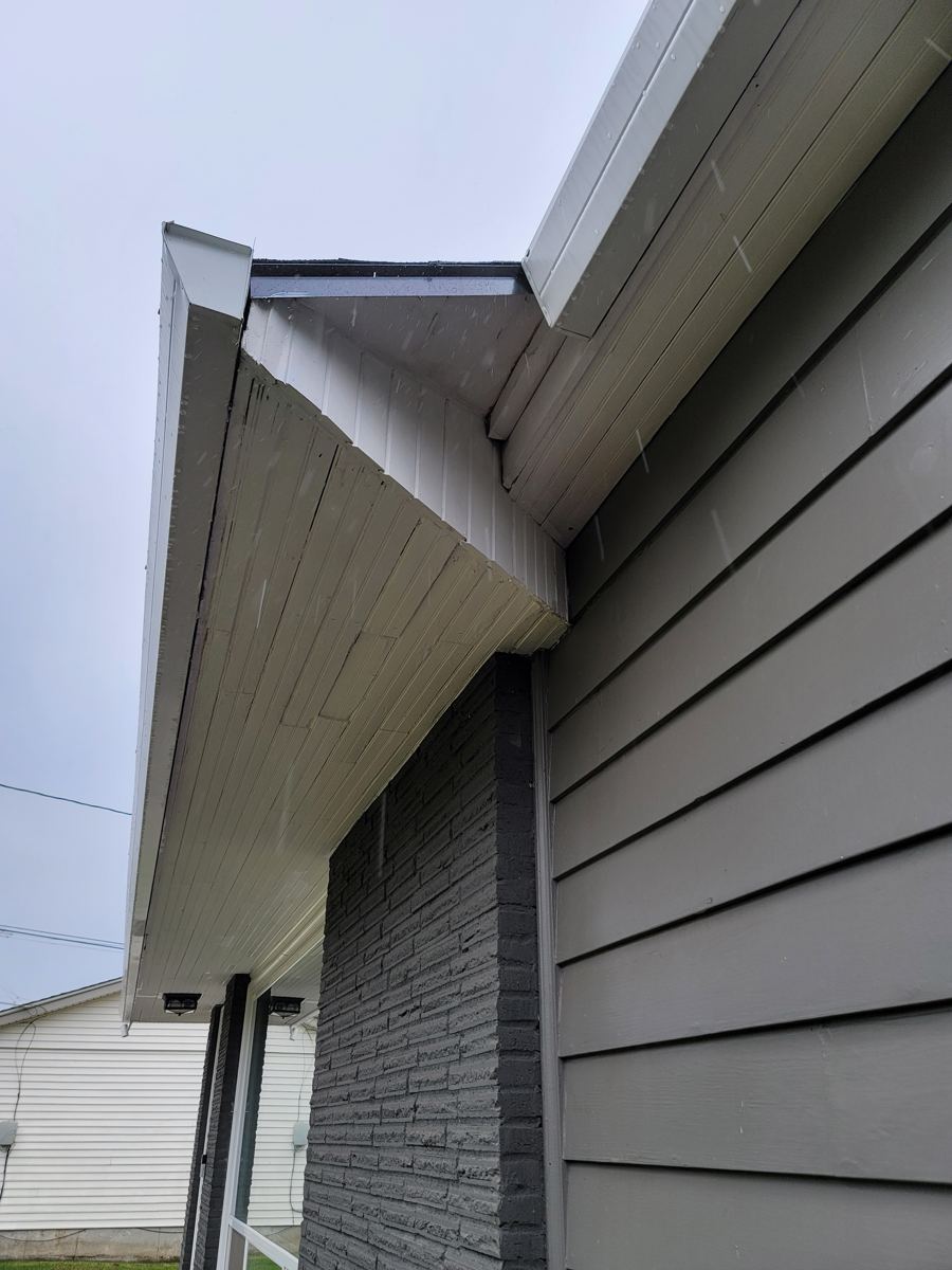 Freshly painted soffit fascia and lap siding detail in Columbia County Oregon