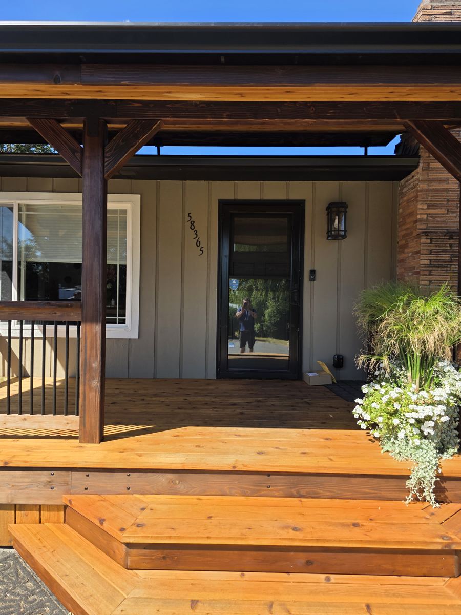 Covered front porch with new cedar decking, steps and planter near St Helens Oregon